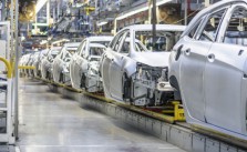 An Image Showing The Production Line In Auto Manufacturing Industry.