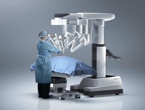 An Image That Showing A Surgeon Working With Robotic Surgical Tool.