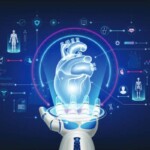 Image of a robotic hand holding a hologram of a human heart and icons related to futuristic medical cybernetics and robotics technology shown around it on a deep blue background.